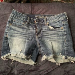 Medium wash AE shorts